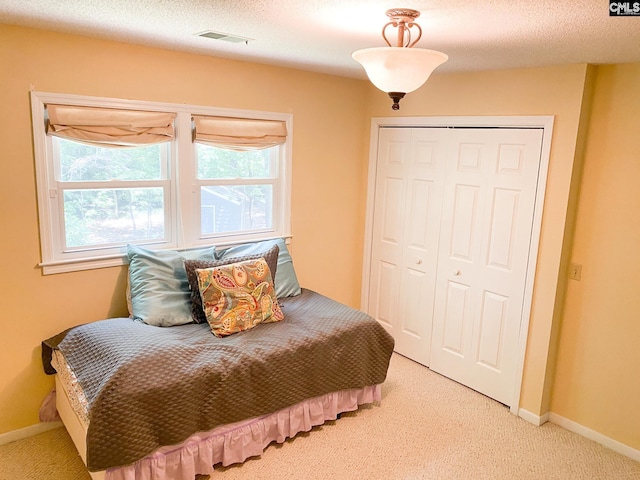 141 Runneymede Dr, Blythewood, SC 29016 - bedroom featuring light colored carpet, a closet, and baseboards