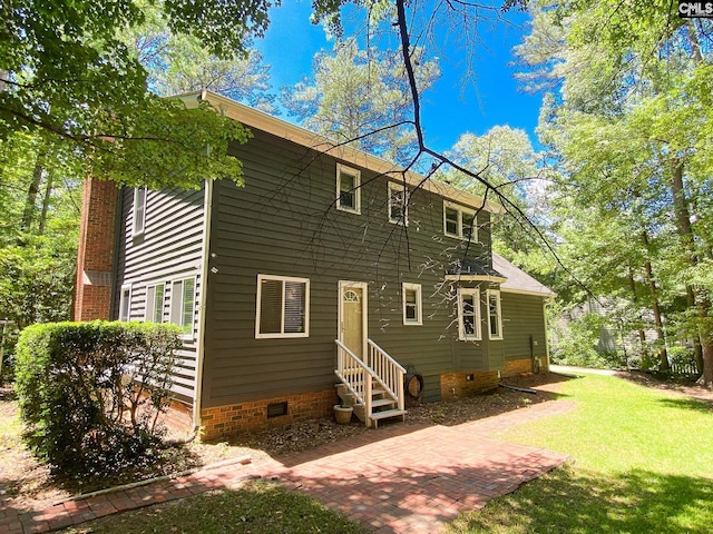 141 Runneymede Dr, Blythewood, SC 29016 - back of property with crawl space, a lawn, and entry steps