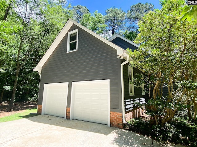 141 Runneymede Dr, Blythewood, SC 29016 - garage with concrete driveway