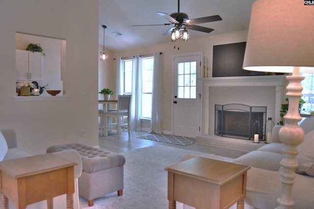 25 Elcock Cir, Irmo, SC 29063 - living room featuring a ceiling fan, wood finished floors, a brick fireplace, baseboards, and lofted ceiling