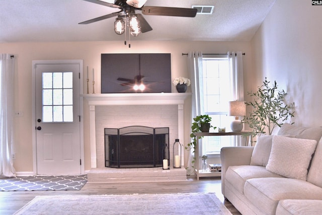 25 Elcock Cir, Irmo, SC 29063 - living area with a ceiling fan, wood finished floors, and a brick fireplace