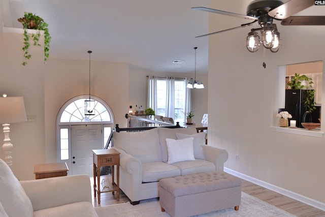 25 Elcock Cir, Irmo, SC 29063 - living area featuring a chandelier, ceiling fan, light wood finished floors, and baseboards