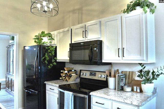 25 Elcock Cir, Irmo, SC 29063 - kitchen featuring black appliances, a chandelier, white cabinetry, and light stone counters