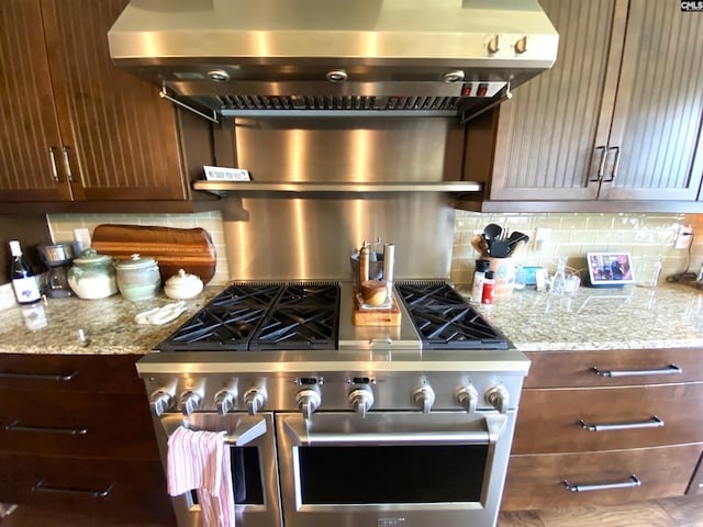 132 Systems Ln, Columbia, SC 29212 - kitchen with range hood, decorative backsplash, range with two ovens, and light stone countertops