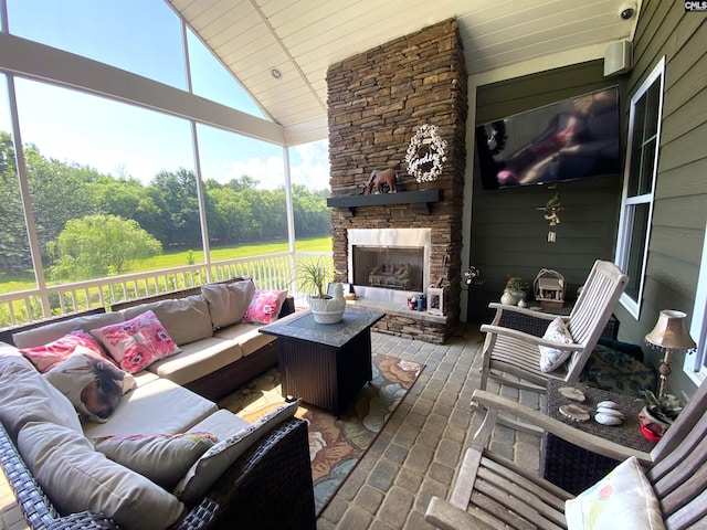 132 Systems Ln, Columbia, SC 29212 - sunroom / solarium featuring an outdoor living space with a fireplace, healthy amount of natural light, and lofted ceiling