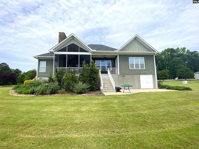 132 Systems Ln, Columbia, SC 29212 - back of house featuring stairway, a chimney, a lawn, and board and batten siding