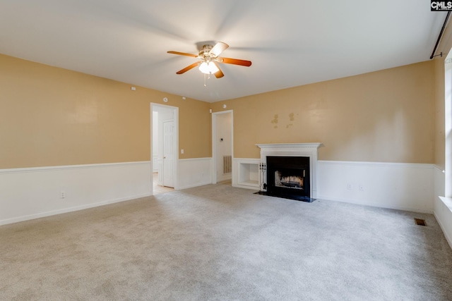 1113 Walden Place Dr, Elgin, SC 29045 - unfurnished living room featuring a ceiling fan, carpet floors, and a fireplace with flush hearth