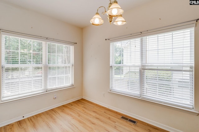 1113 Walden Place Dr, Elgin, SC 29045 - empty room with a chandelier, light wood finished floors, and baseboards