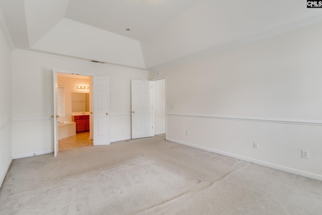 1113 Walden Place Dr, Elgin, SC 29045 - unfurnished bedroom with light carpet, a raised ceiling, baseboards, and ensuite bath
