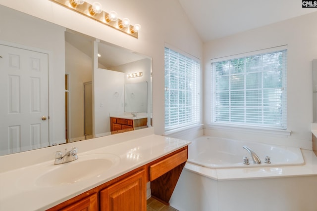 1113 Walden Place Dr, Elgin, SC 29045 - bathroom with vaulted ceiling, a garden tub, vanity, and a stall shower