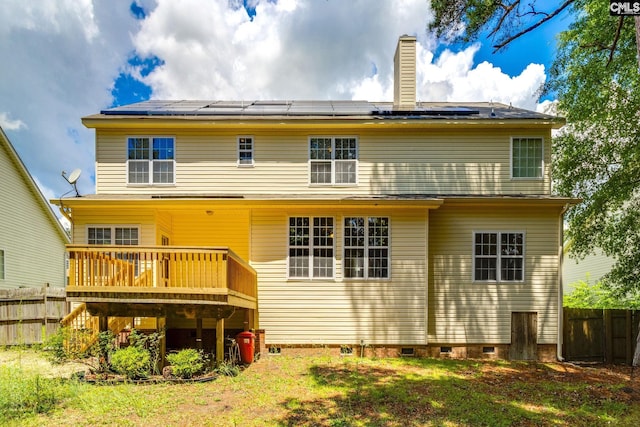 1113 Walden Place Dr, Elgin, SC 29045 - back of house featuring crawl space, a wooden deck, solar panels, and a chimney