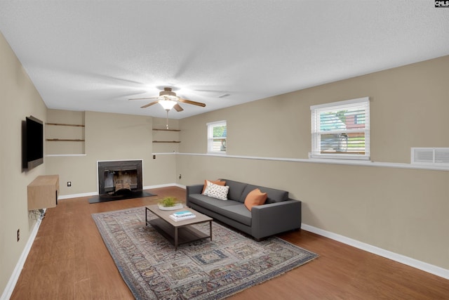320 Trowbridge Rd, Columbia, SC 29229 - living area featuring wood finished floors, a ceiling fan, baseboards, and a textured ceiling
