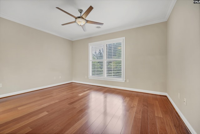 1324 Pulaski St Unit A105, Columbia, SC 29201 - empty room featuring wood finished floors, ceiling fan, baseboards, and crown molding