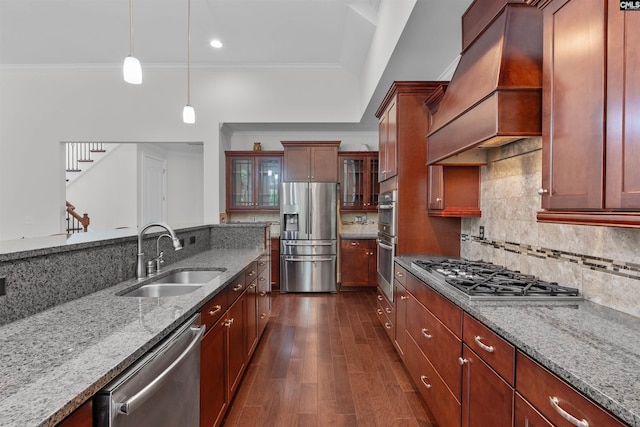 135 Bay Wren Rd, Blythewood, SC 29016 - kitchen with appliances with stainless steel finishes, a sink, custom range hood, light stone counters, and pendant lighting