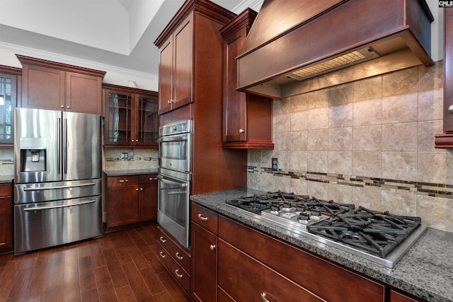 135 Bay Wren Rd, Blythewood, SC 29016 - kitchen with appliances with stainless steel finishes, custom range hood, backsplash, and dark stone counters