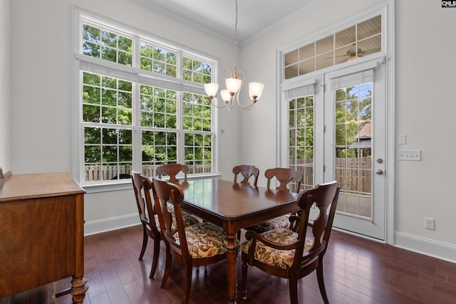 135 Bay Wren Rd, Blythewood, SC 29016 - dining room with healthy amount of natural light, a chandelier, dark wood-type flooring, baseboards, and crown molding