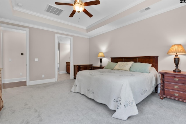 135 Bay Wren Rd, Blythewood, SC 29016 - carpeted bedroom with crown molding, a tray ceiling, connected bathroom, baseboards, and ceiling fan