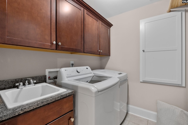 135 Bay Wren Rd, Blythewood, SC 29016 - washroom featuring separate washer and dryer, cabinet space, light tile patterned flooring, and baseboards