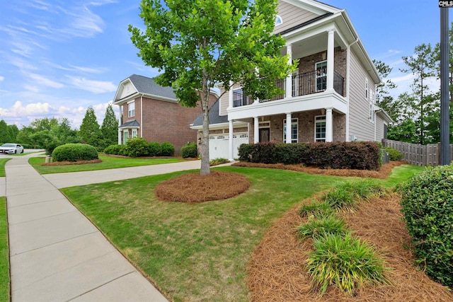 135 Bay Wren Rd, Blythewood, SC 29016 - greek revival inspired property with a balcony, brick siding, concrete driveway, and a garage