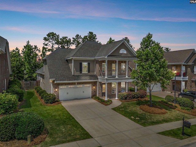 135 Bay Wren Rd, Blythewood, SC 29016 - greek revival inspired property featuring brick siding, concrete driveway, an attached garage, a balcony, and a shingled roof