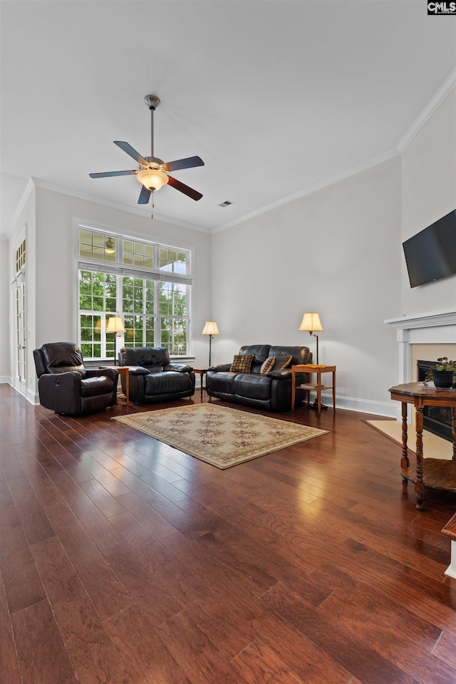 135 Bay Wren Rd, Blythewood, SC 29016 - living area featuring ornamental molding, a ceiling fan, a fireplace, wood finished floors, and baseboards