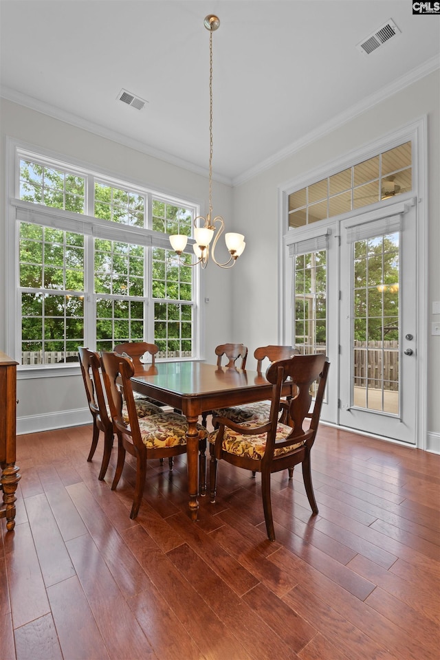 135 Bay Wren Rd, Blythewood, SC 29016 - dining room with crown molding, a chandelier, dark wood finished floors, and baseboards