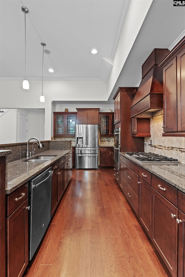 135 Bay Wren Rd, Blythewood, SC 29016 - kitchen featuring appliances with stainless steel finishes, a sink, dark wood-type flooring, stone counters, and decorative light fixtures
