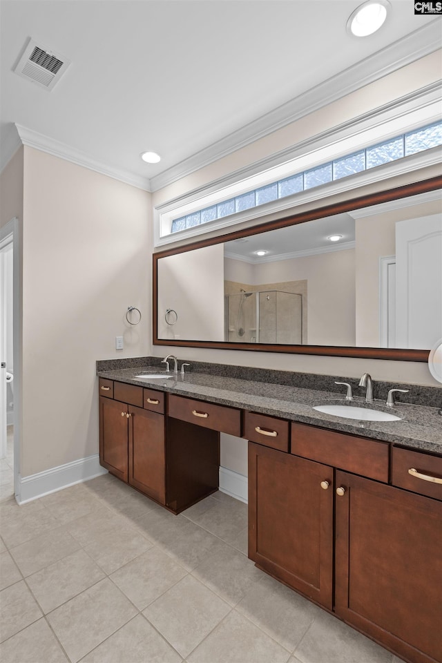 135 Bay Wren Rd, Blythewood, SC 29016 - bathroom featuring double vanity, ornamental molding, tile patterned floors, baseboards, and a shower with shower door