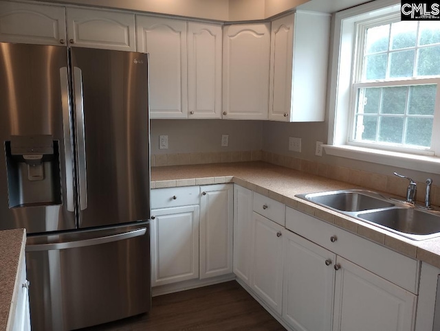 1699 Green Hill Rd, Lugoff, SC 29078 - kitchen featuring stainless steel fridge, a sink, white cabinetry, and light countertops