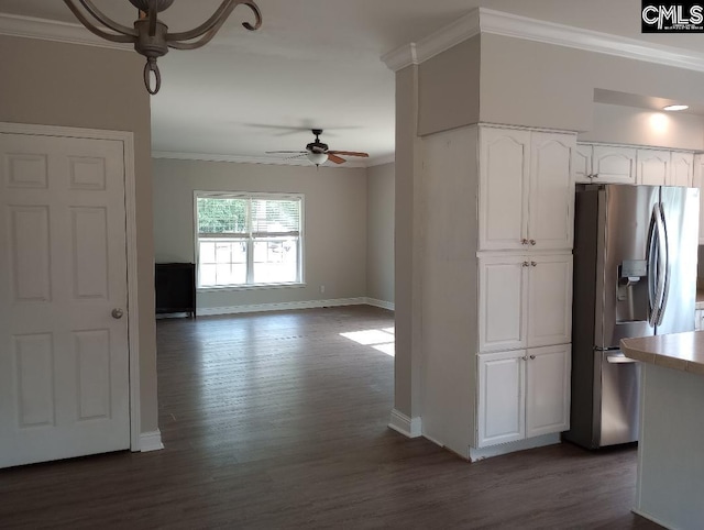 1699 Green Hill Rd, Lugoff, SC 29078 - kitchen with stainless steel fridge, a ceiling fan, baseboards, crown molding, and white cabinetry