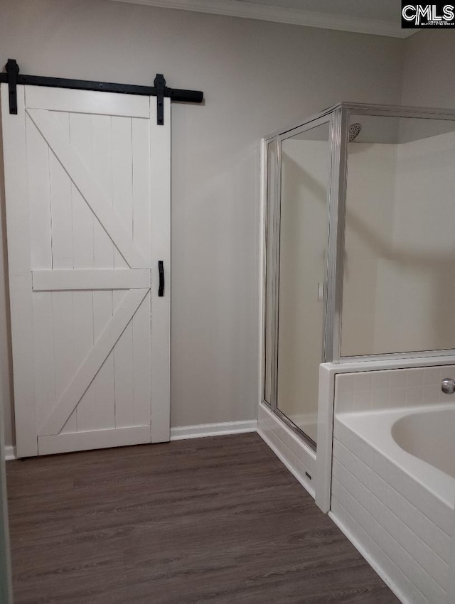 1699 Green Hill Rd, Lugoff, SC 29078 - bathroom featuring a shower stall, a garden tub, ornamental molding, wood finished floors, and baseboards