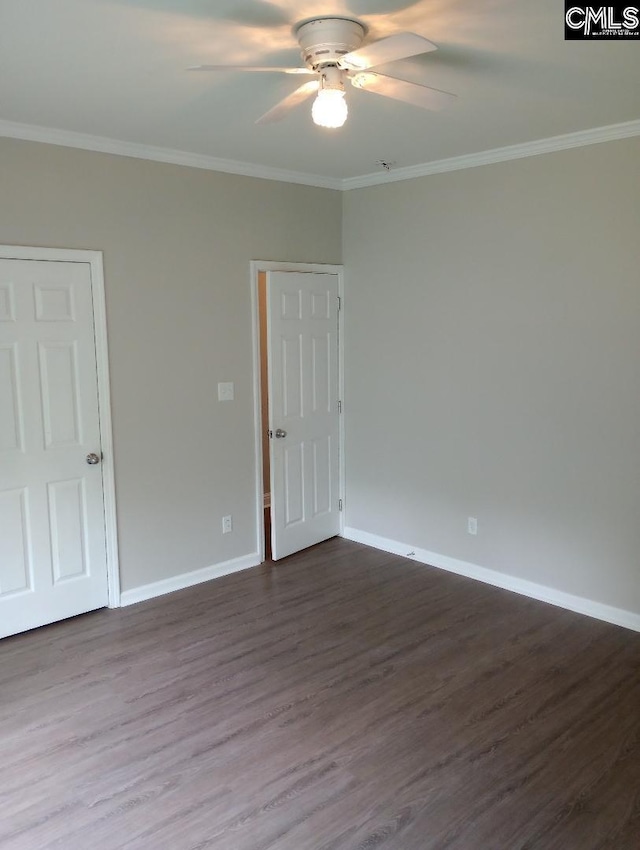 1699 Green Hill Rd, Lugoff, SC 29078 - spare room featuring a ceiling fan, dark wood-style floors, crown molding, and baseboards