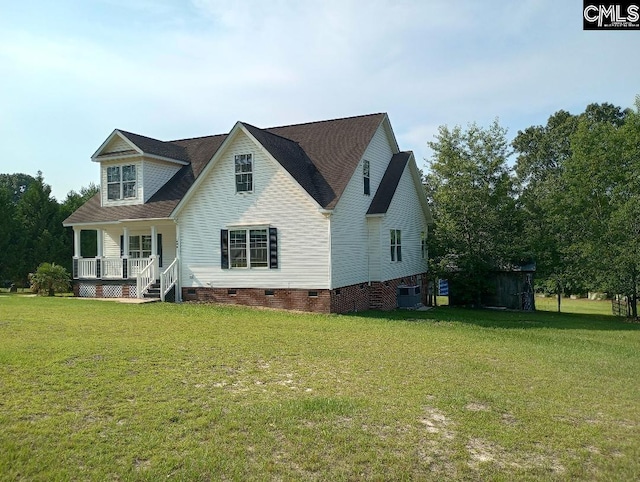 1699 Green Hill Rd, Lugoff, SC 29078 - view of front of property with crawl space, a porch, central AC unit, and a front lawn