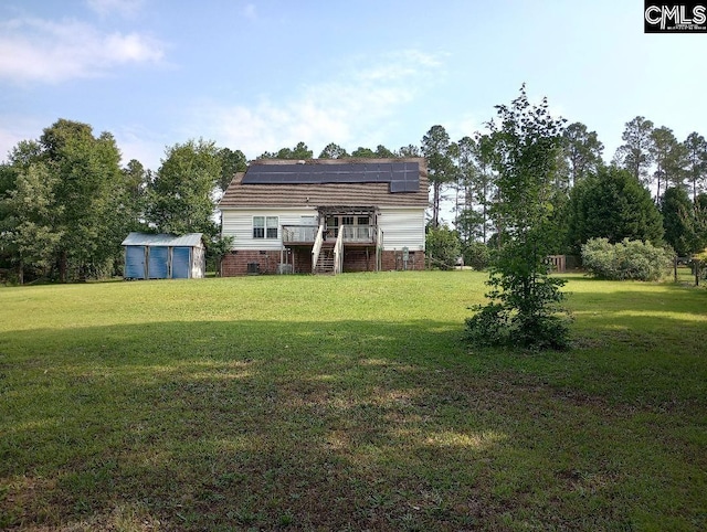 1699 Green Hill Rd, Lugoff, SC 29078 - view of green lawn with stairway and a deck