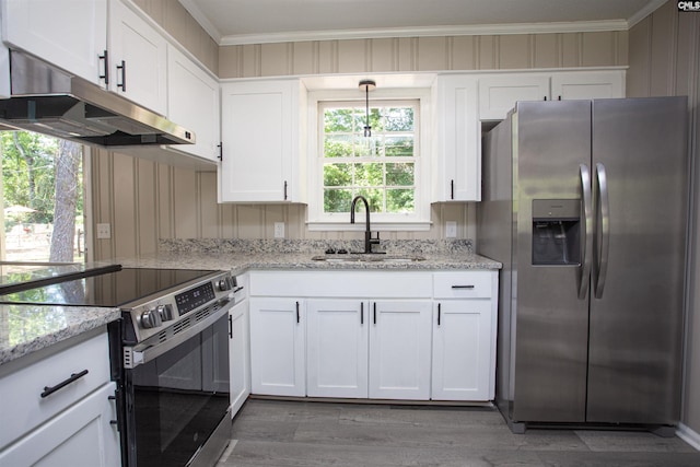 4513 Bonnie Forest Blvd, Columbia, SC 29210 - kitchen featuring appliances with stainless steel finishes, a sink, under cabinet range hood, white cabinets, and light wood finished floors