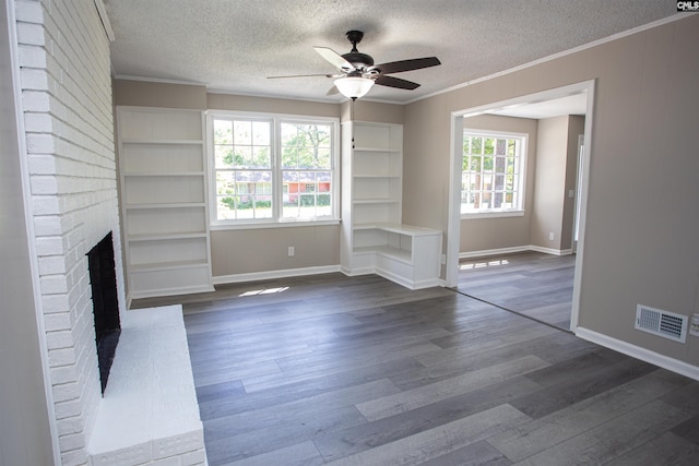 4513 Bonnie Forest Blvd, Columbia, SC 29210 - unfurnished living room featuring ornamental molding, ceiling fan, a textured ceiling, dark wood finished floors, and a fireplace
