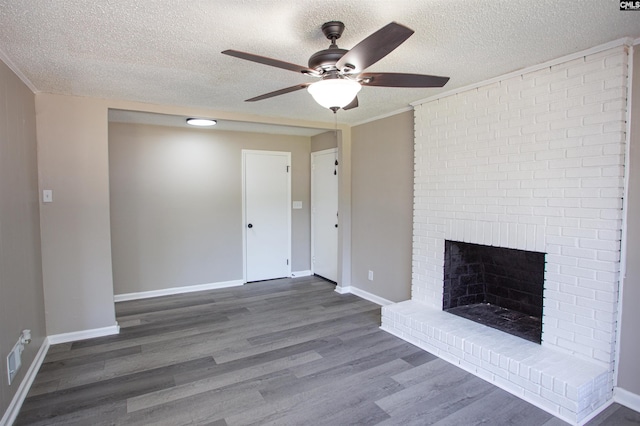 4513 Bonnie Forest Blvd, Columbia, SC 29210 - unfurnished living room featuring a ceiling fan, wood finished floors, a textured ceiling, baseboards, and a brick fireplace