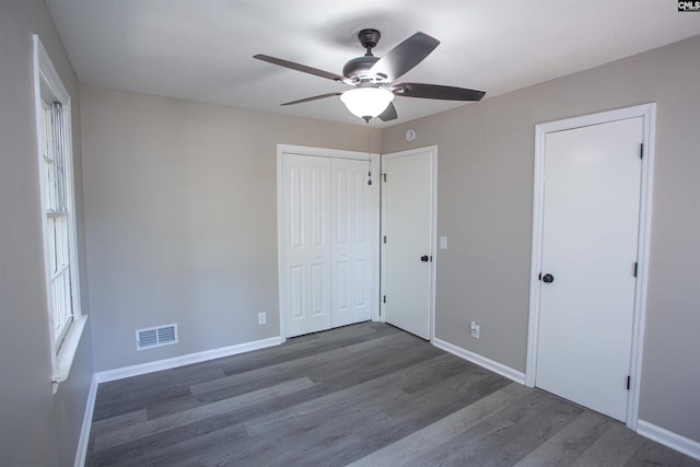 4513 Bonnie Forest Blvd, Columbia, SC 29210 - unfurnished bedroom featuring wood finished floors, baseboards, and a ceiling fan
