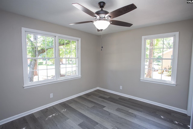 4513 Bonnie Forest Blvd, Columbia, SC 29210 - empty room with plenty of natural light, baseboards, dark wood-style flooring, and a ceiling fan
