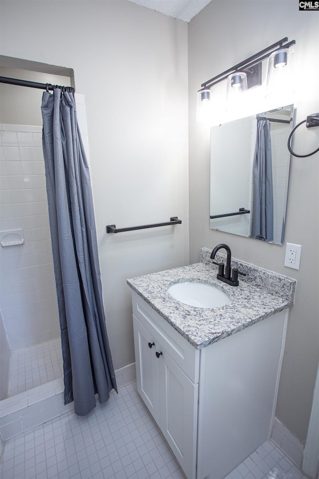 4513 Bonnie Forest Blvd, Columbia, SC 29210 - full bath with tile patterned floors, vanity, a tile shower, and baseboards