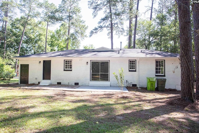 4513 Bonnie Forest Blvd, Columbia, SC 29210 - rear view of property featuring crawl space, brick siding, a patio area, and a yard