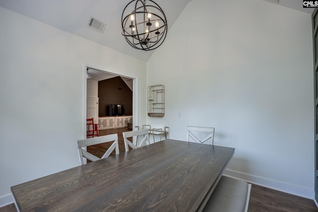 67 Ole Still Ln, Elgin, SC 29045 - dining area with a chandelier, dark wood-style flooring, baseboards, and high vaulted ceiling