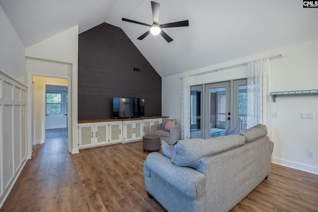 67 Ole Still Ln, Elgin, SC 29045 - living room featuring high vaulted ceiling, ceiling fan, wood finished floors, baseboards, and wood walls