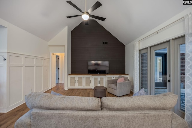 67 Ole Still Ln, Elgin, SC 29045 - living room featuring wood finished floors, a ceiling fan, vaulted ceiling, and a decorative wall