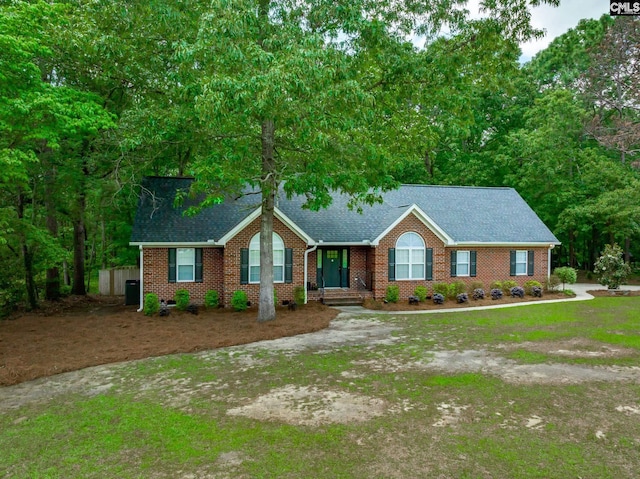 67 Ole Still Ln, Elgin, SC 29045 - ranch-style house featuring roof with shingles, brick siding, and a front yard