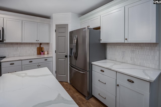 67 Ole Still Ln, Elgin, SC 29045 - kitchen featuring stainless steel fridge with ice dispenser, decorative backsplash, dark wood-type flooring, and light stone countertops
