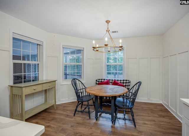 67 Ole Still Ln, Elgin, SC 29045 - dining area with a decorative wall, a chandelier, dark wood-style flooring, and wainscoting