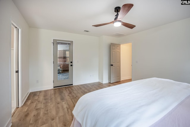 67 Ole Still Ln, Elgin, SC 29045 - bedroom with light wood finished floors, baseboards, and ceiling fan