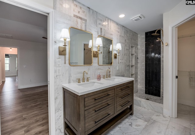 67 Ole Still Ln, Elgin, SC 29045 - full bathroom with double vanity, a walk in shower, baseboards, and a walk in closet