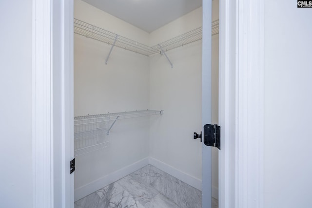 67 Ole Still Ln, Elgin, SC 29045 - spacious closet with light marble finish floors